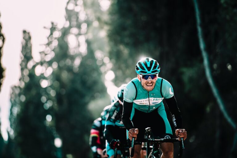 Helmeted cyclist riding on a road