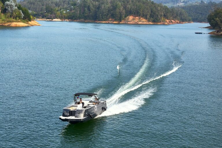 Recreational motorboat traveling across a lake