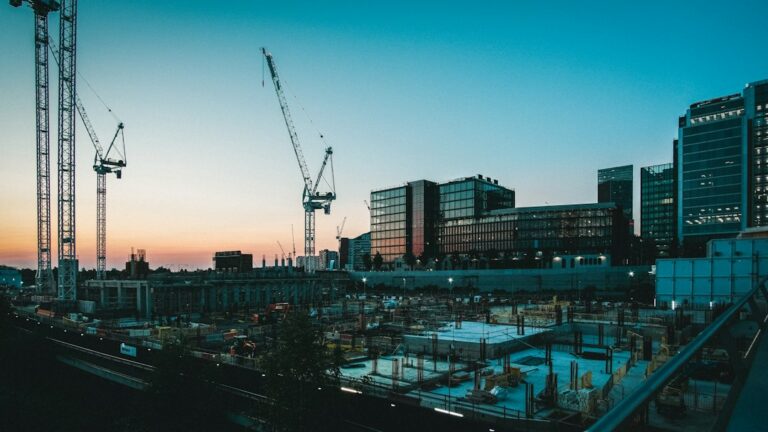 Construction site with cranes and a building under construction