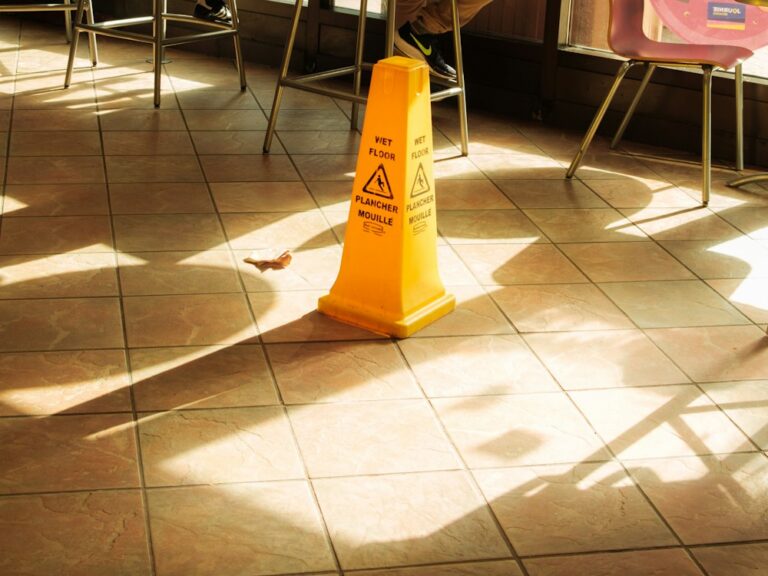 Yellow wet floor caution sign indoors
