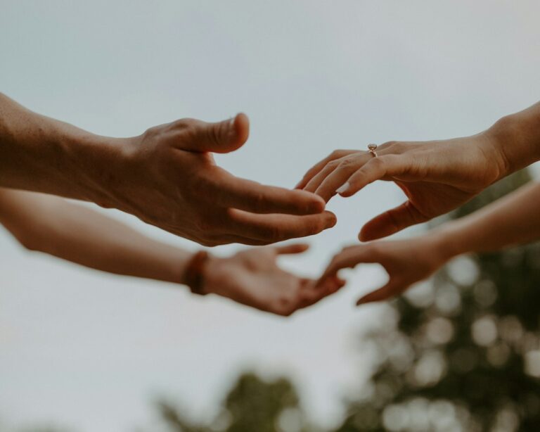 Hands reaching out in support
